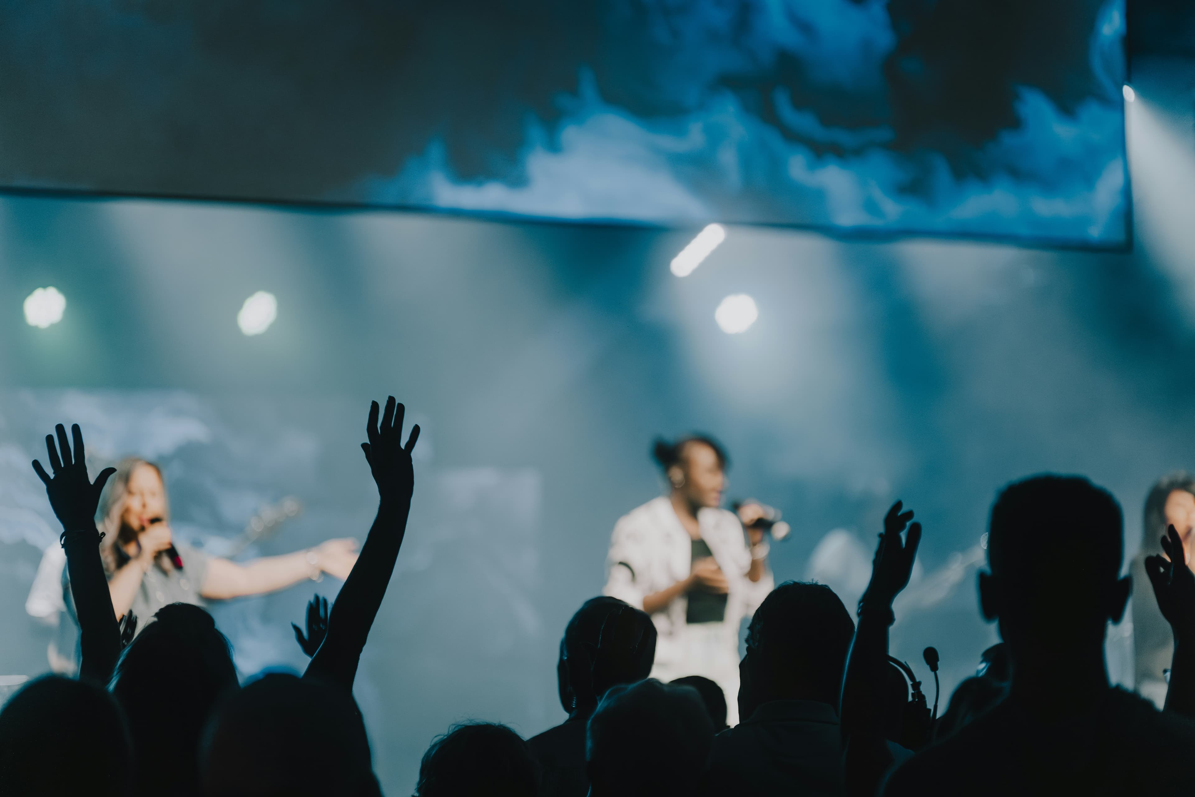 Church worship team performing on stage with stage lighting